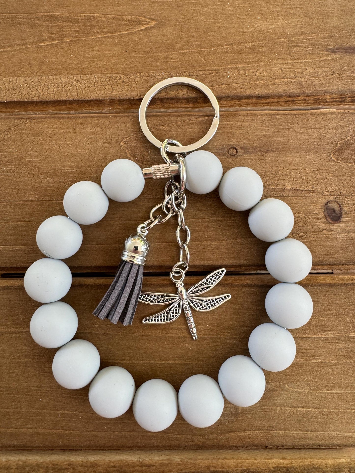 Elegant Stainless Steel Cable Wristlet - Silicone Beads, Leather Tassel & Dragonfly Charm