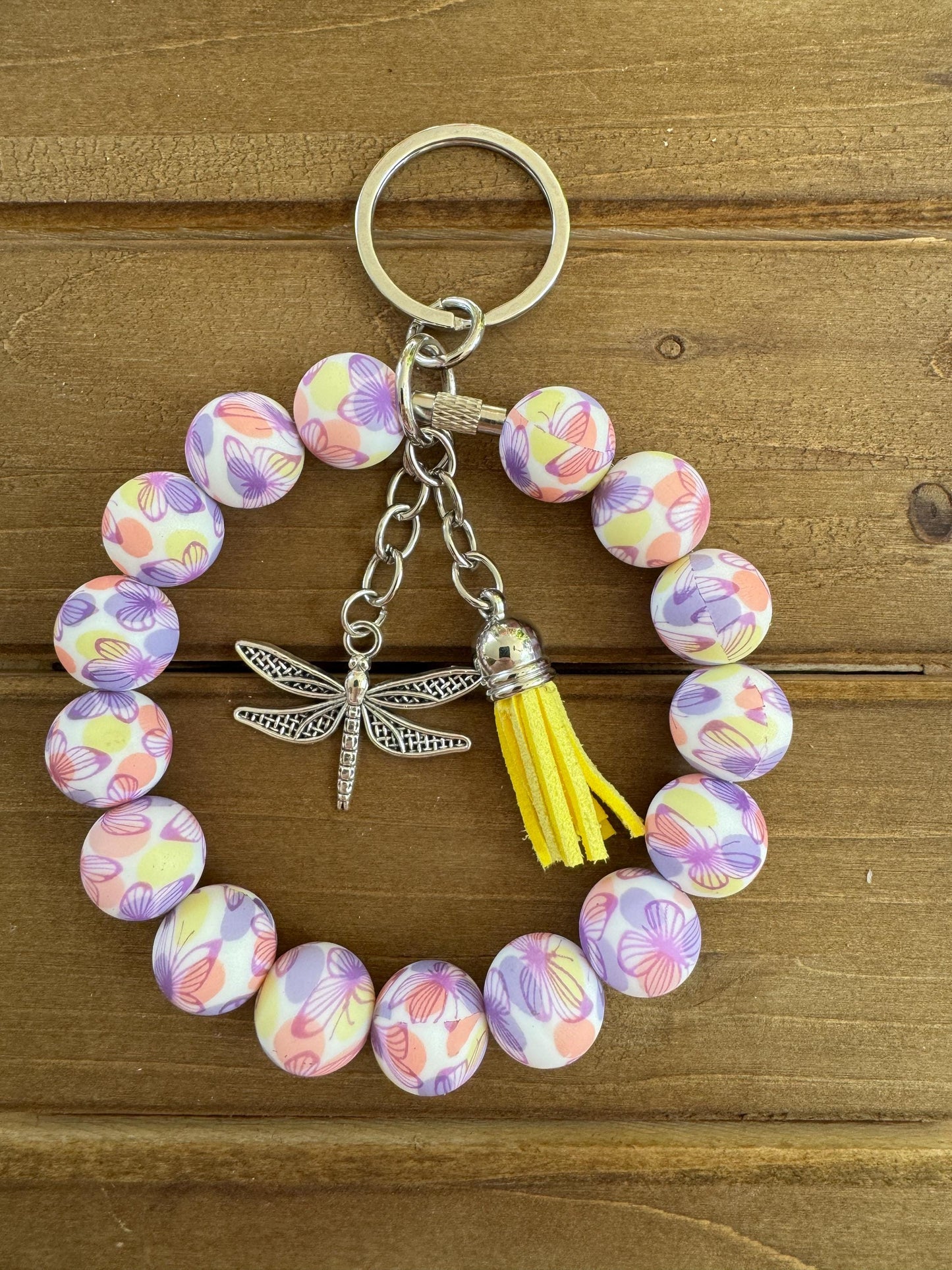 Elegant Stainless Steel Cable Wristlet - Silicone Beads, Leather Tassel & Dragonfly Charm
